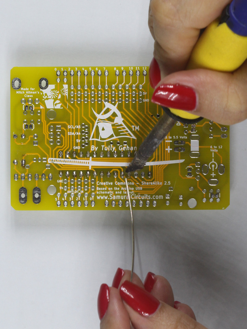 Solder all microcontroller socket pins